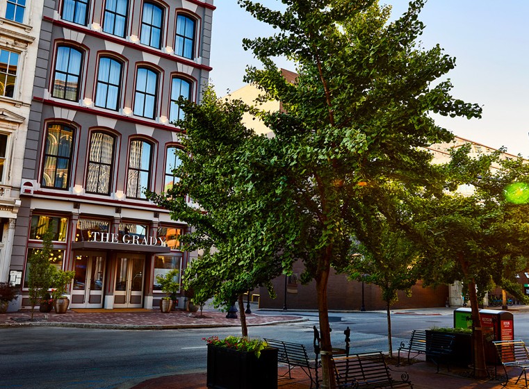 exterior with trees in the street in front of it
